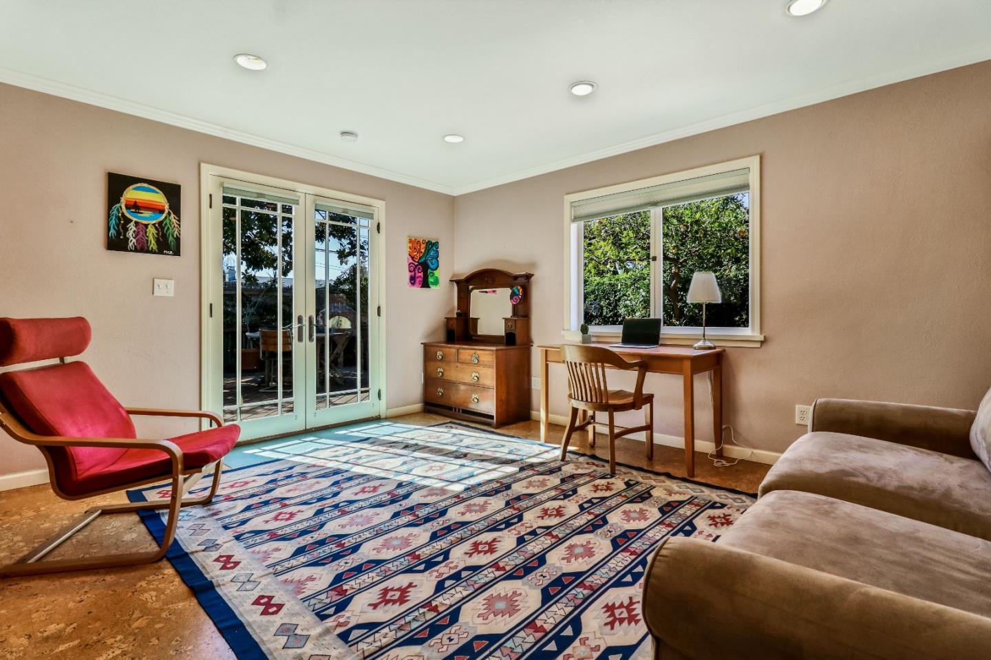 1401 Channing Way Berkeley, CA 94702 - Photo 31 of 43 a living room with furniture a rug and a large window