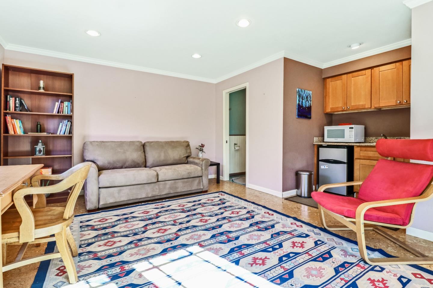 1401 Channing Way Berkeley, CA 94702 - Photo 32 of 43 a living room with furniture and a rug