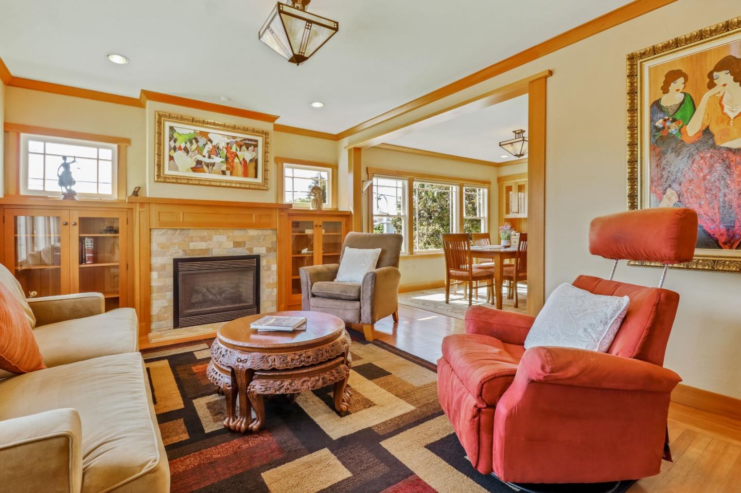 1401 Channing Way Berkeley, CA 94702 - Photo 7 of 43 a living room with furniture a rug and a fireplace