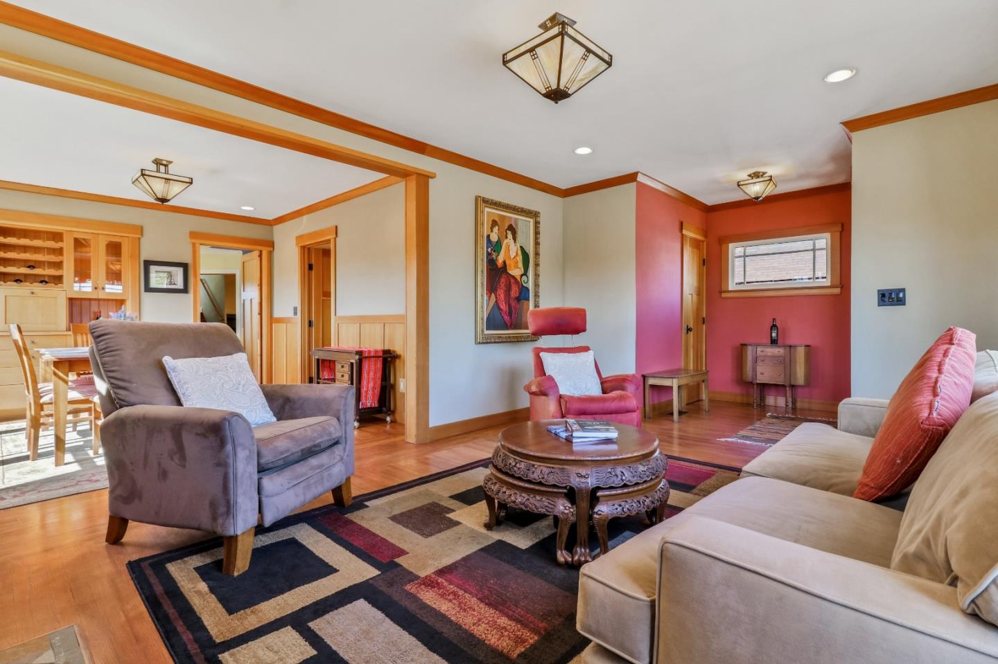 1401 Channing Way Berkeley, CA 94702 - Photo 8 of 43 a living room with furniture a flat screen tv and a window