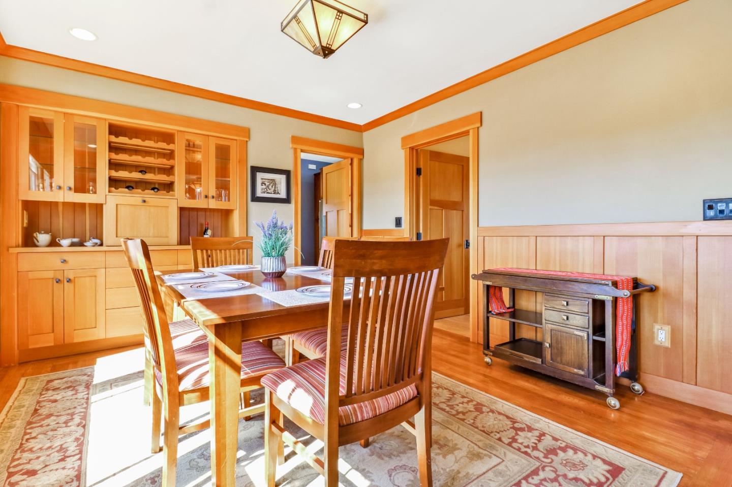 1401 Channing Way Berkeley, CA 94702 - Photo 10 of 43 a dining room with furniture a fireplace and wooden floor