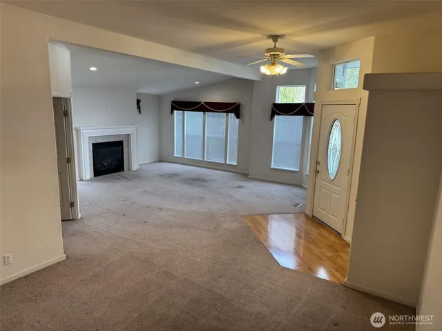 a view of livingroom with furniture and a fireplace