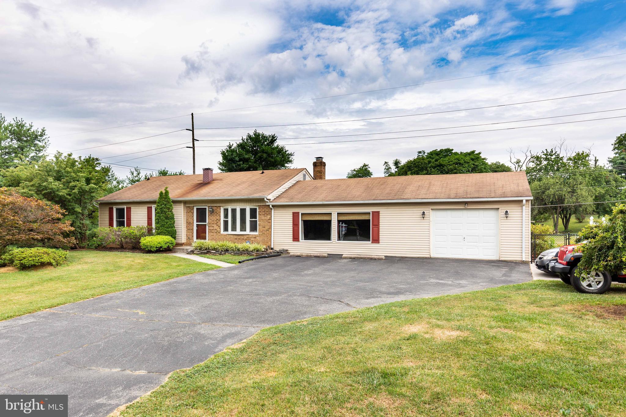 Front View to show the Family  Rm section & garage