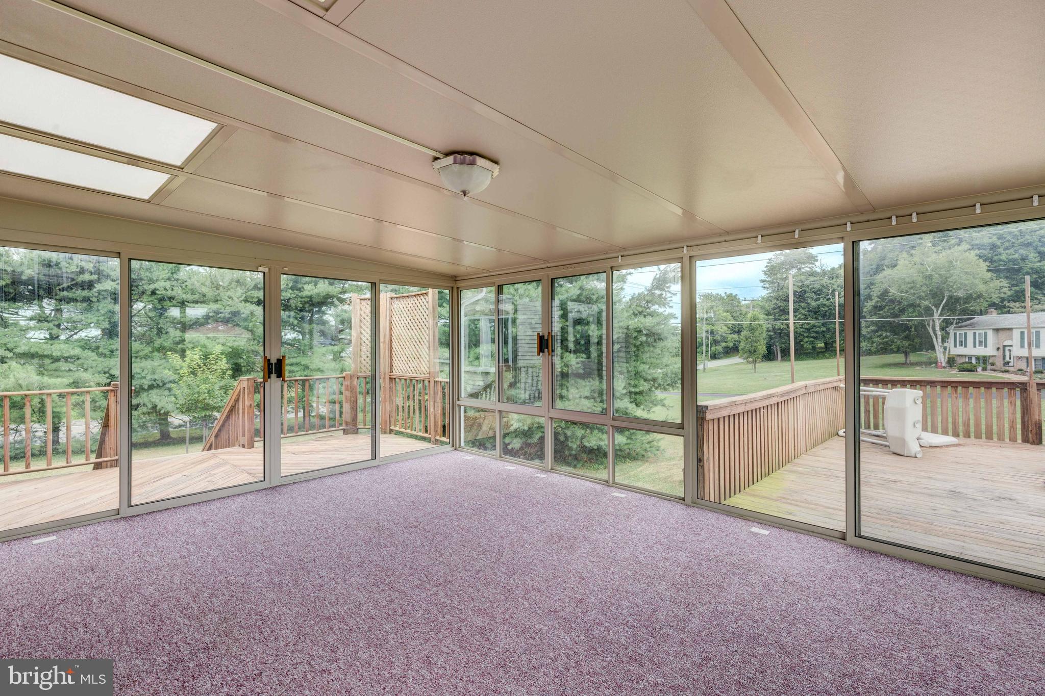 5698 Linton Road Sykesville, MD 21784 - Photo 13 of 42 Sun Room has 3 sets of sliders to decking