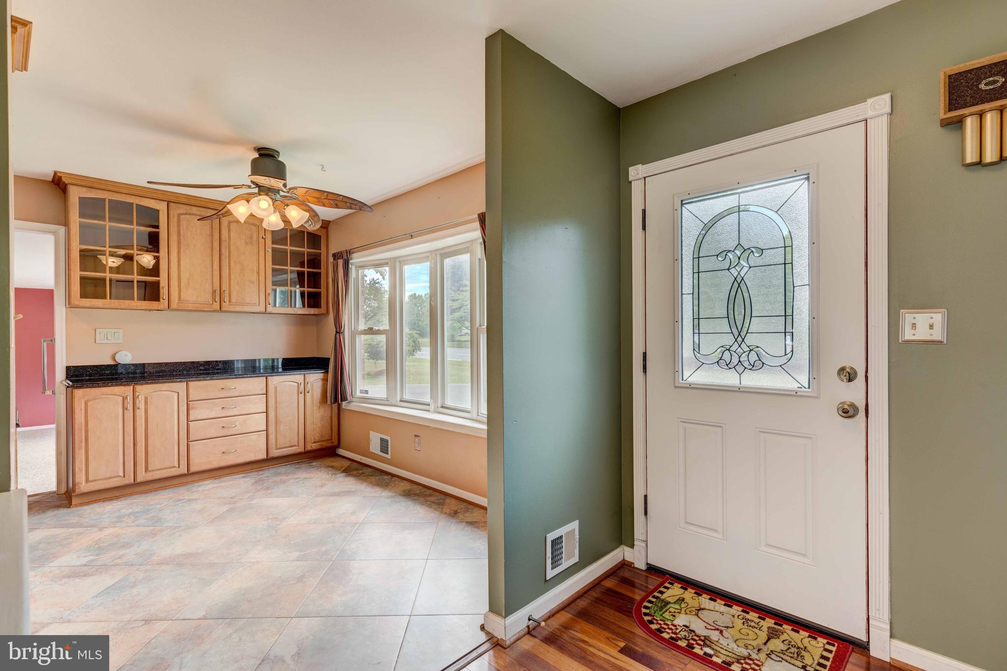Entry hall looking into kitchen