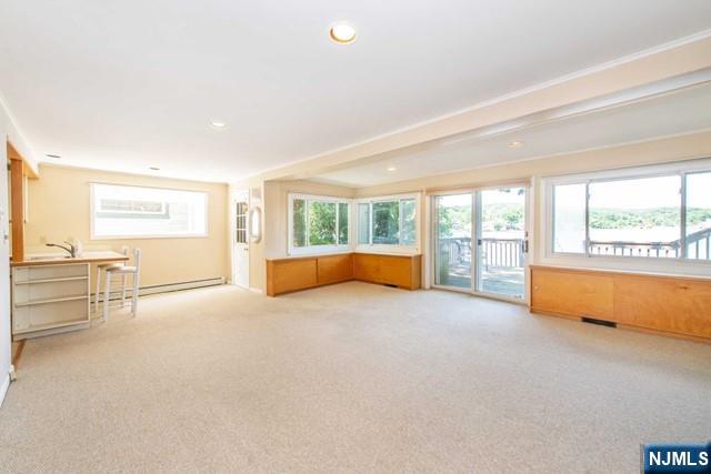 21 East Shore Road Denville, NJ 07834 - Photo 8 of 23 an empty room with furniture and floor to ceiling window