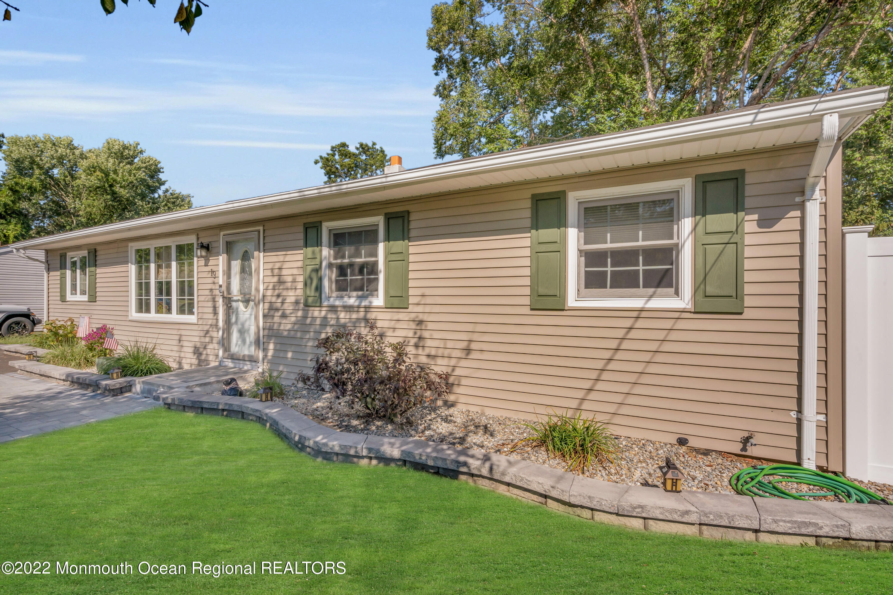 19 Lark Lane Brick, NJ 08724 - Photo 31 of 72 a view of a house with a yard and potted plants