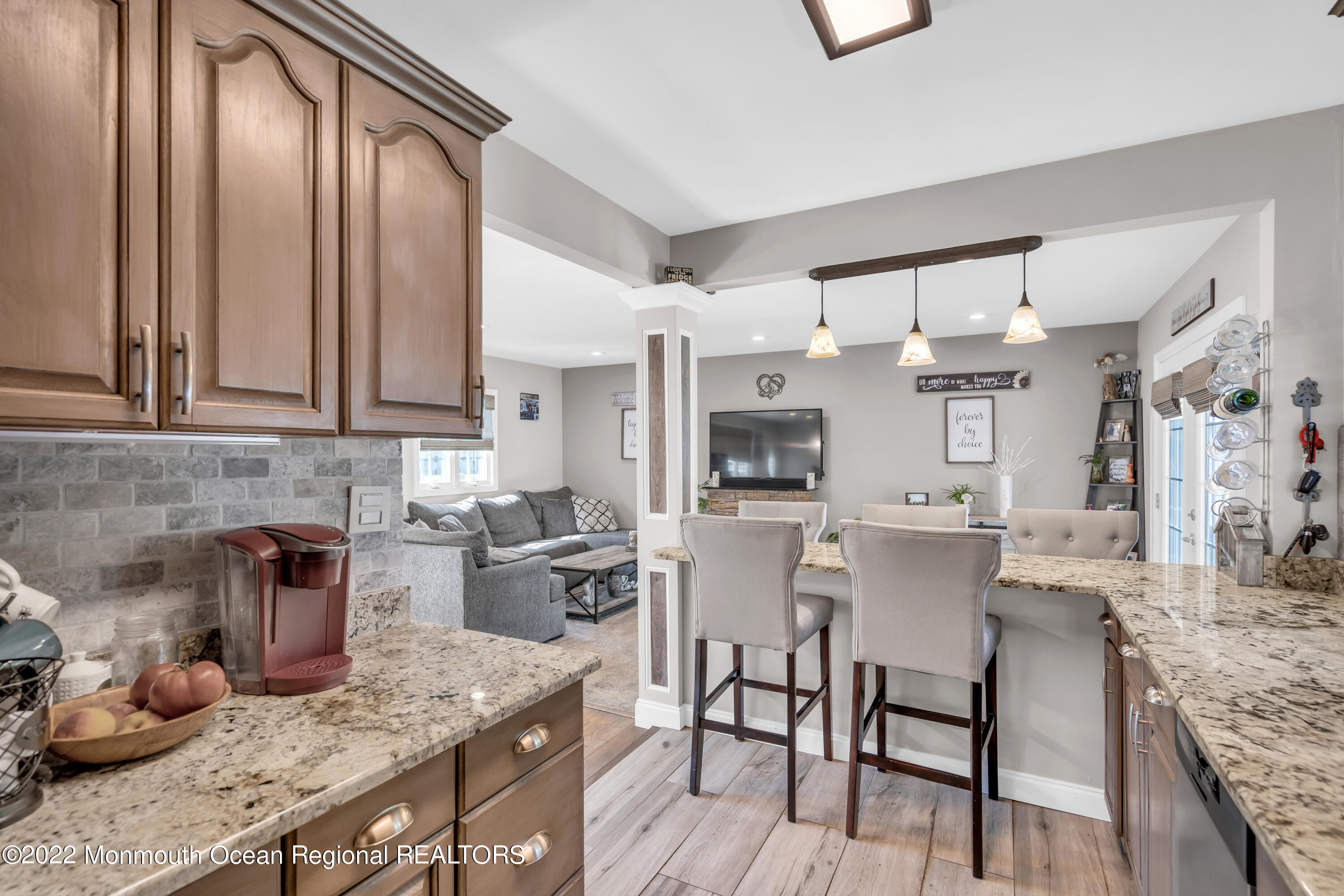 19 Lark Lane Brick, NJ 08724 - Photo 43 of 72 a kitchen with granite countertop a sink stove and cabinets