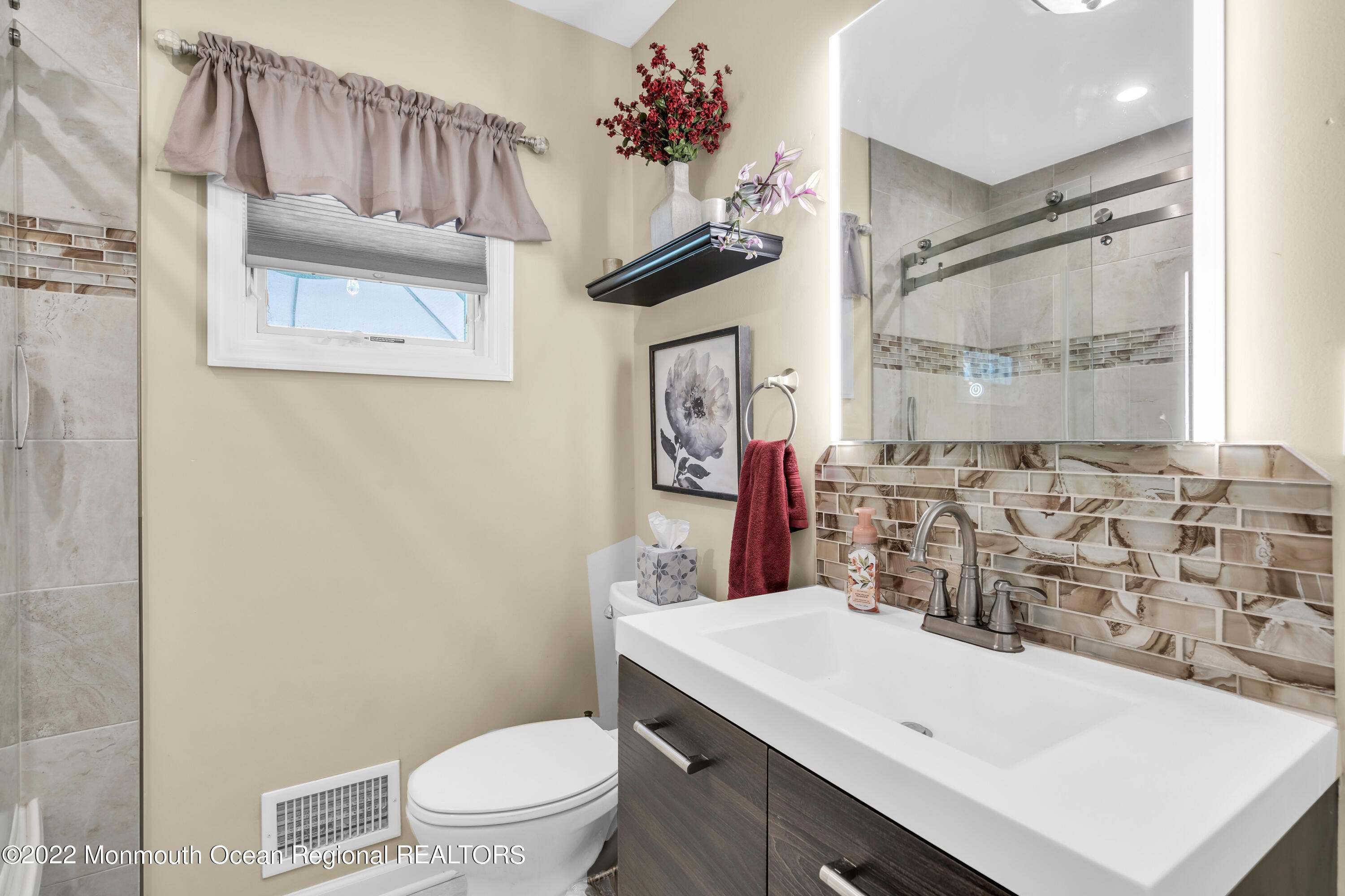 19 Lark Lane Brick, NJ 08724 - Photo 46 of 72 a bathroom with a sink a toilet and a mirror