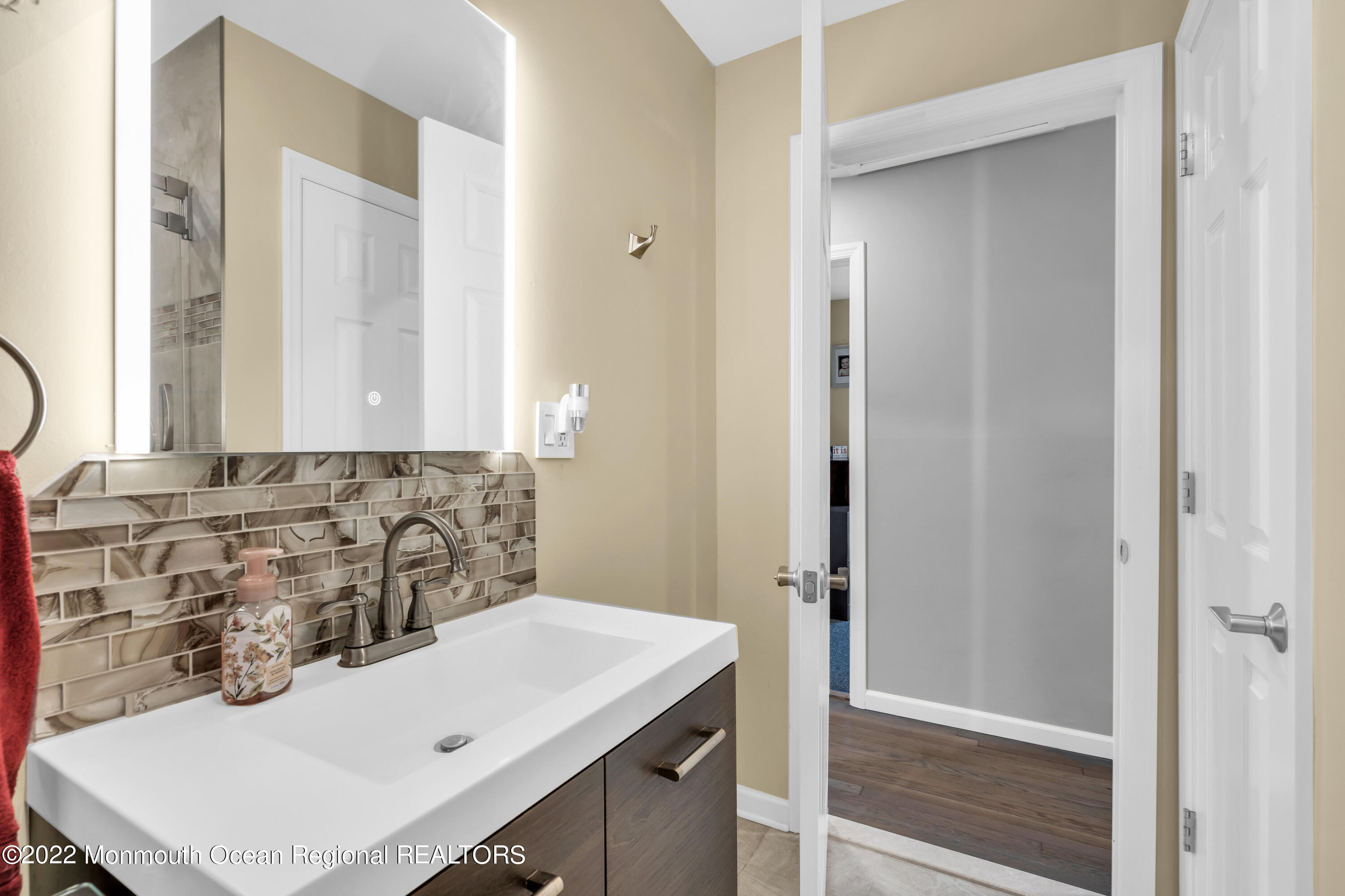 19 Lark Lane Brick, NJ 08724 - Photo 47 of 72 a bathroom with a sink and a mirror