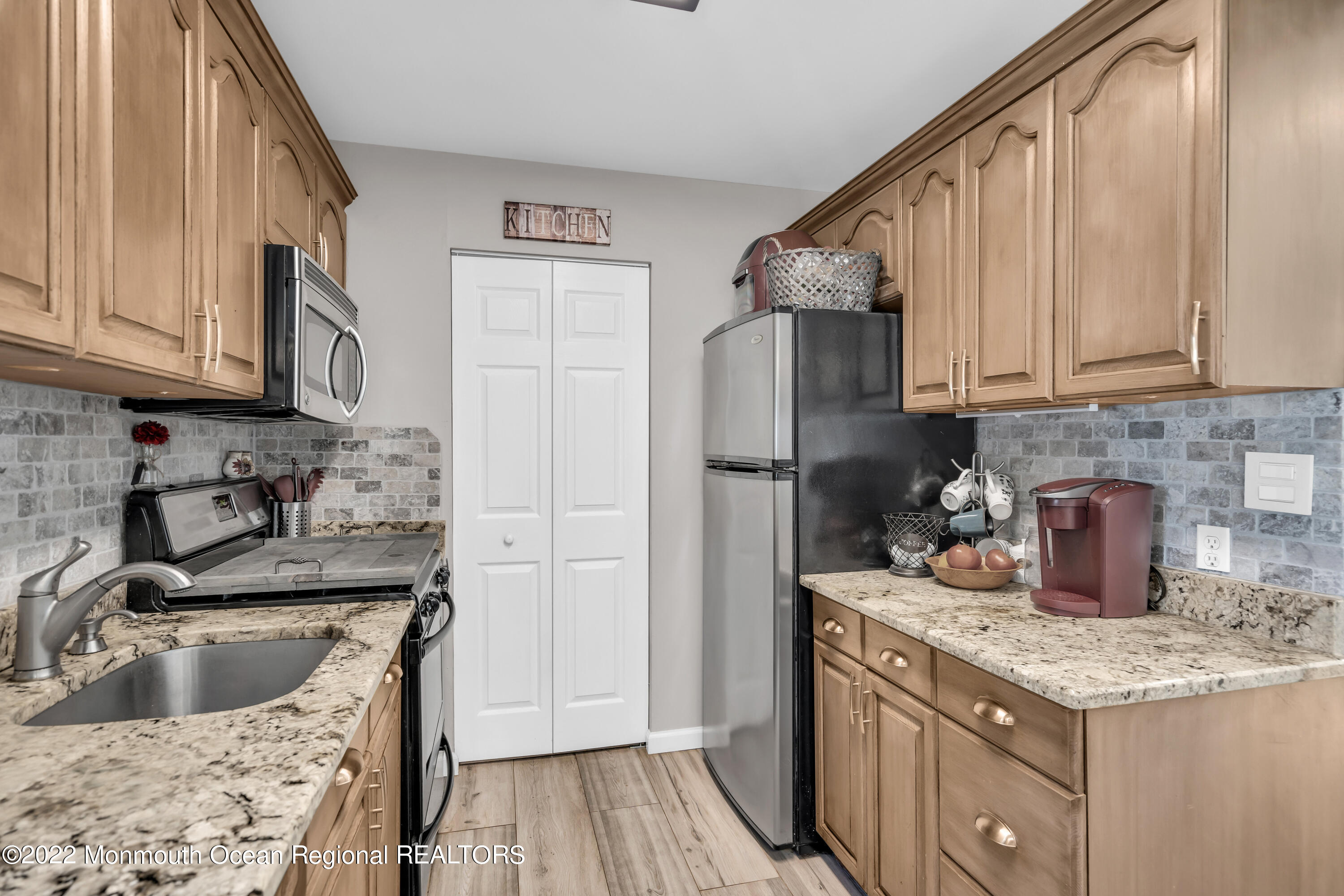 19 Lark Lane Brick, NJ 08724 - Photo 9 of 72 a kitchen with a sink stove and refrigerator