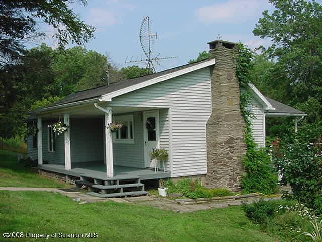 1 Rr Mehoopany, PA 18629 - Photo 1 of 4 a view of a backyard with plants and large tree