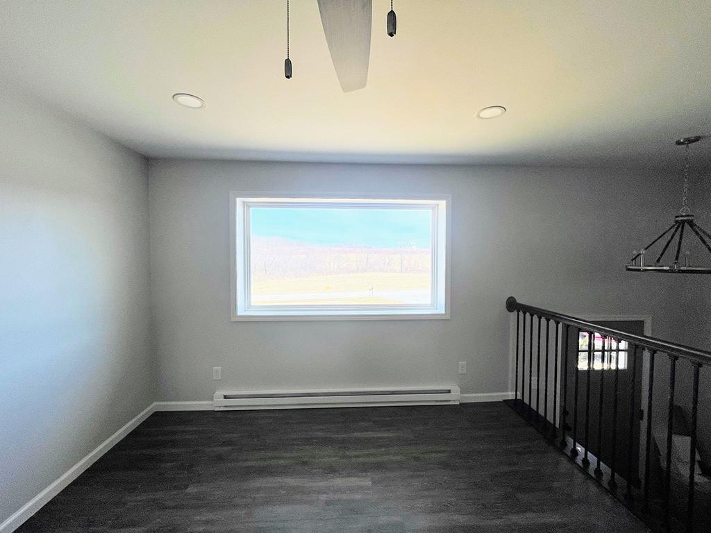949 Fenton Road Indiana, PA 15701 - Photo 3 of 27 a view of an empty room with wooden floor and a window