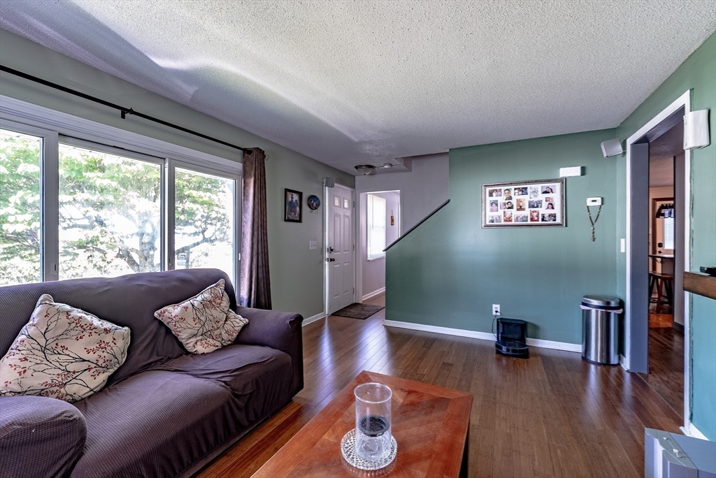299 Morton Street Springfield, MA 01119 - Photo 20 of 37 a living room with furniture and a large window