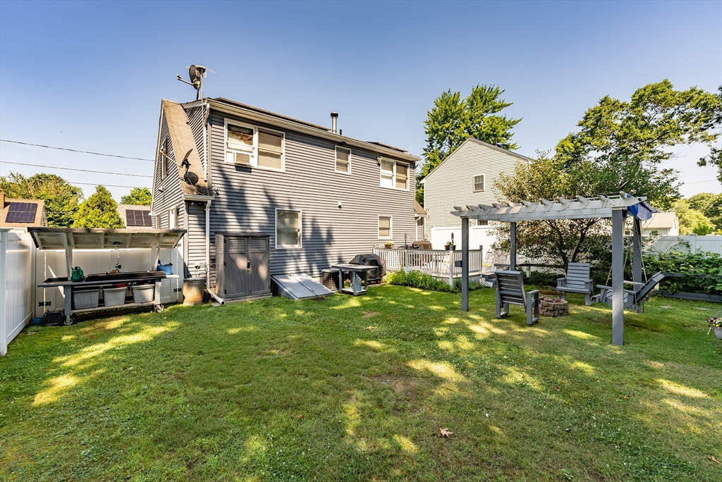 299 Morton Street Springfield, MA 01119 - Photo 5 of 37 a backyard of a house with table and chairs