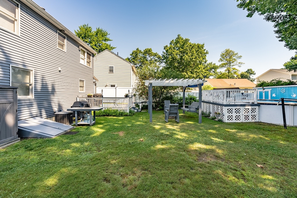 299 Morton Street Springfield, MA 01119 - Photo 6 of 37 a view of a house with a yard porch and sitting area
