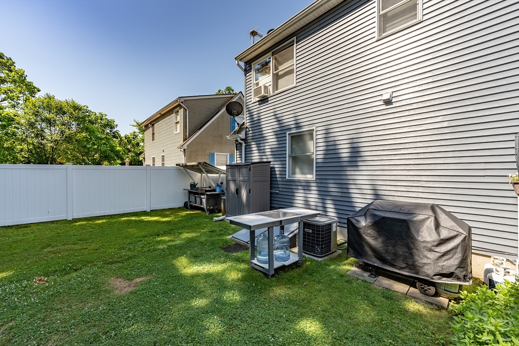 299 Morton Street Springfield, MA 01119 - Photo 9 of 37 a backyard of a house with table and chairs