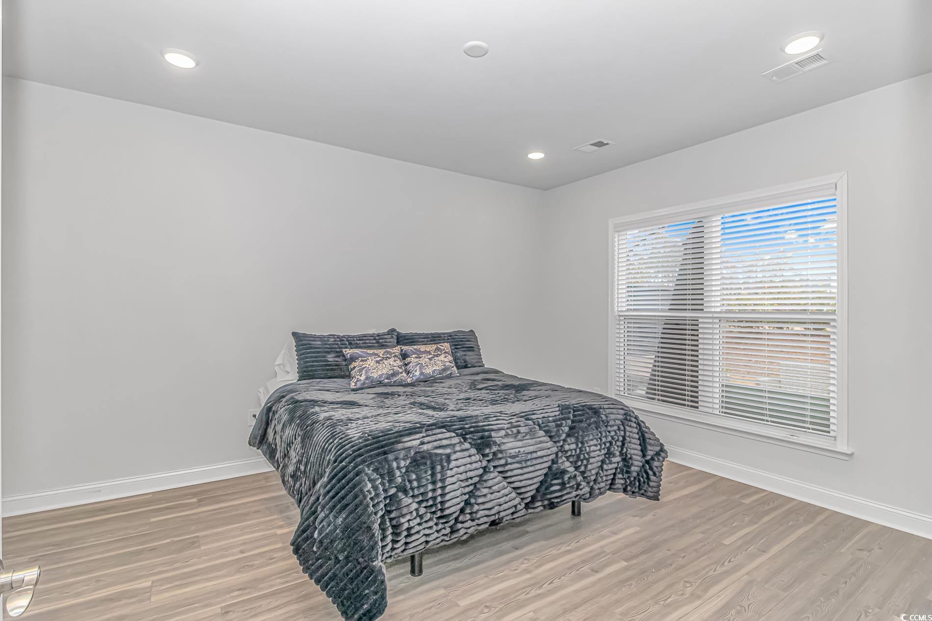 6076 Campanella Street Myrtle Beach, SC 29577 - Photo 20 of 29 Bedroom with light wood finished floors, baseboards, visible vents, and recessed lighting