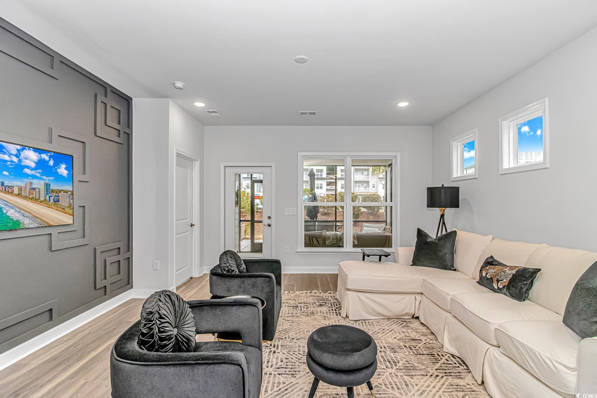 6076 Campanella Street Myrtle Beach, SC 29577 - Photo 8 of 29 Living area featuring light wood finished floors, visible vents, and recessed lighting