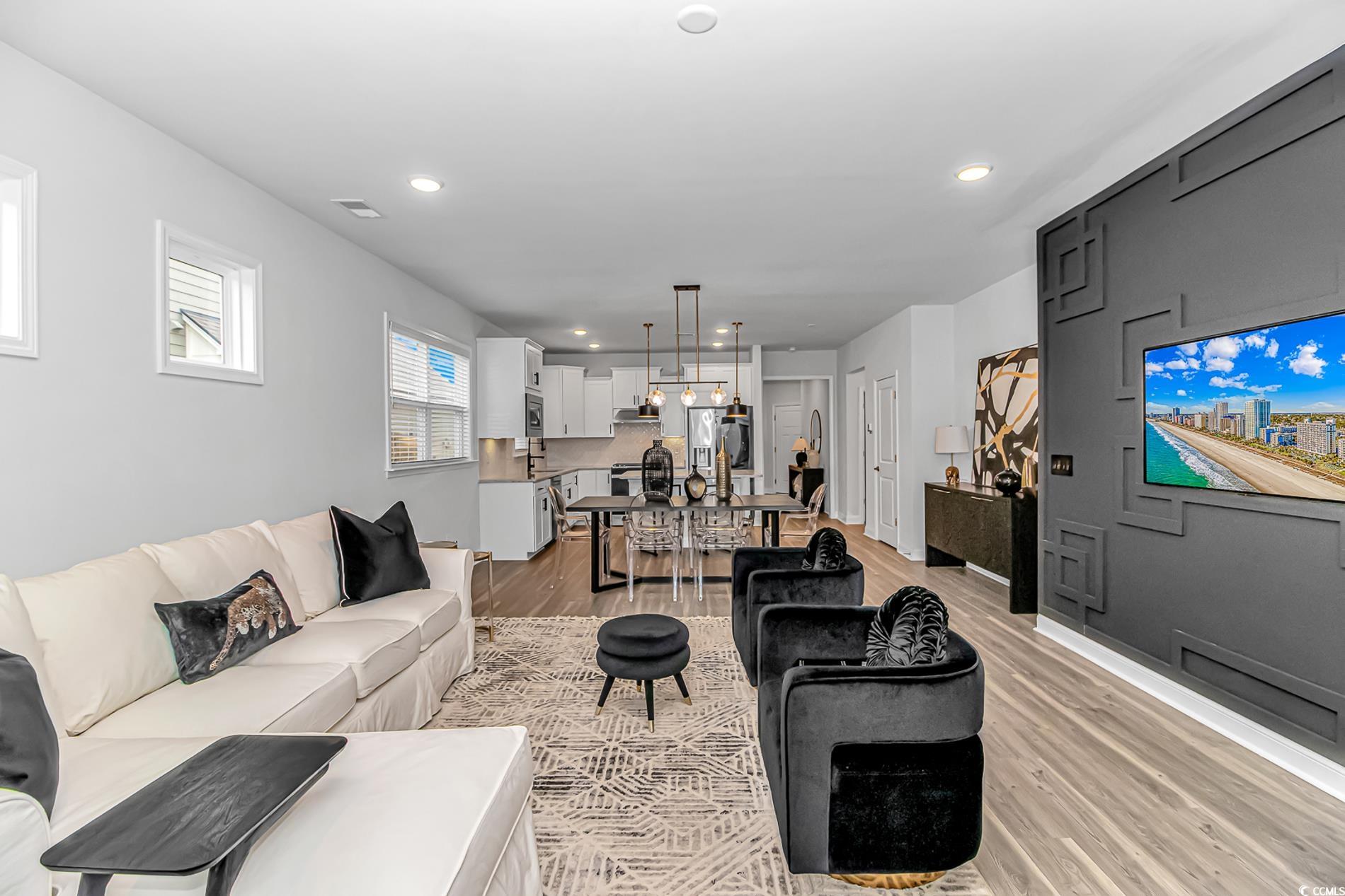 6076 Campanella Street Myrtle Beach, SC 29577 - Photo 10 of 29 Living area with light wood-style floors, visible vents, and recessed lighting