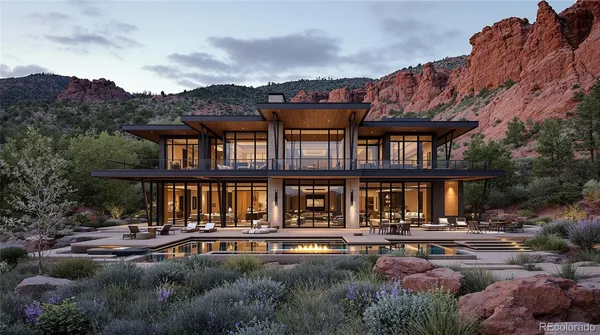 a front view of a house with swimming pool and a yard