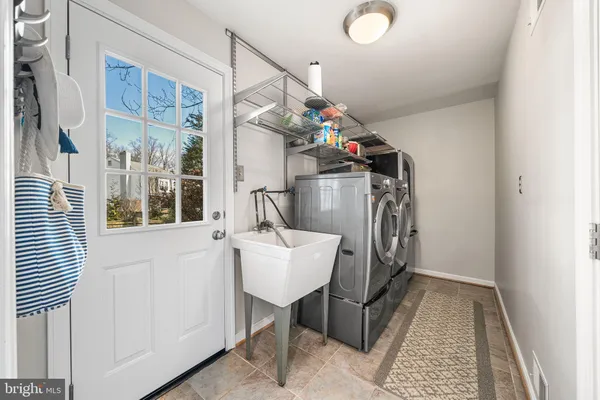 a workspace with furniture window and wooden floor