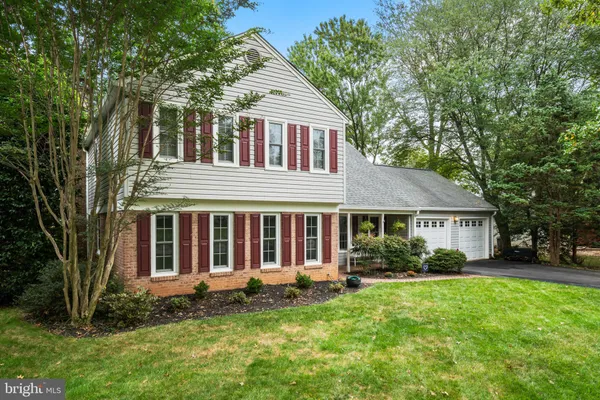 a view of a house with a yard and plants