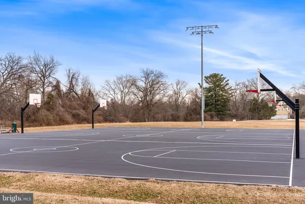 a backyard of a house with outdoor seating and trees