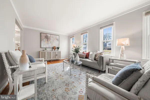 a living room with furniture and a table