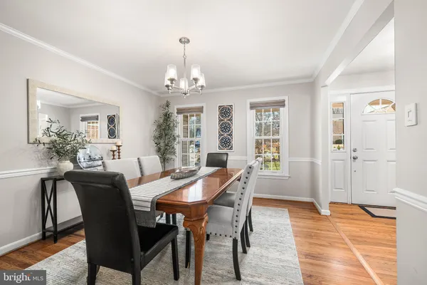 a view of a dining room with furniture and window