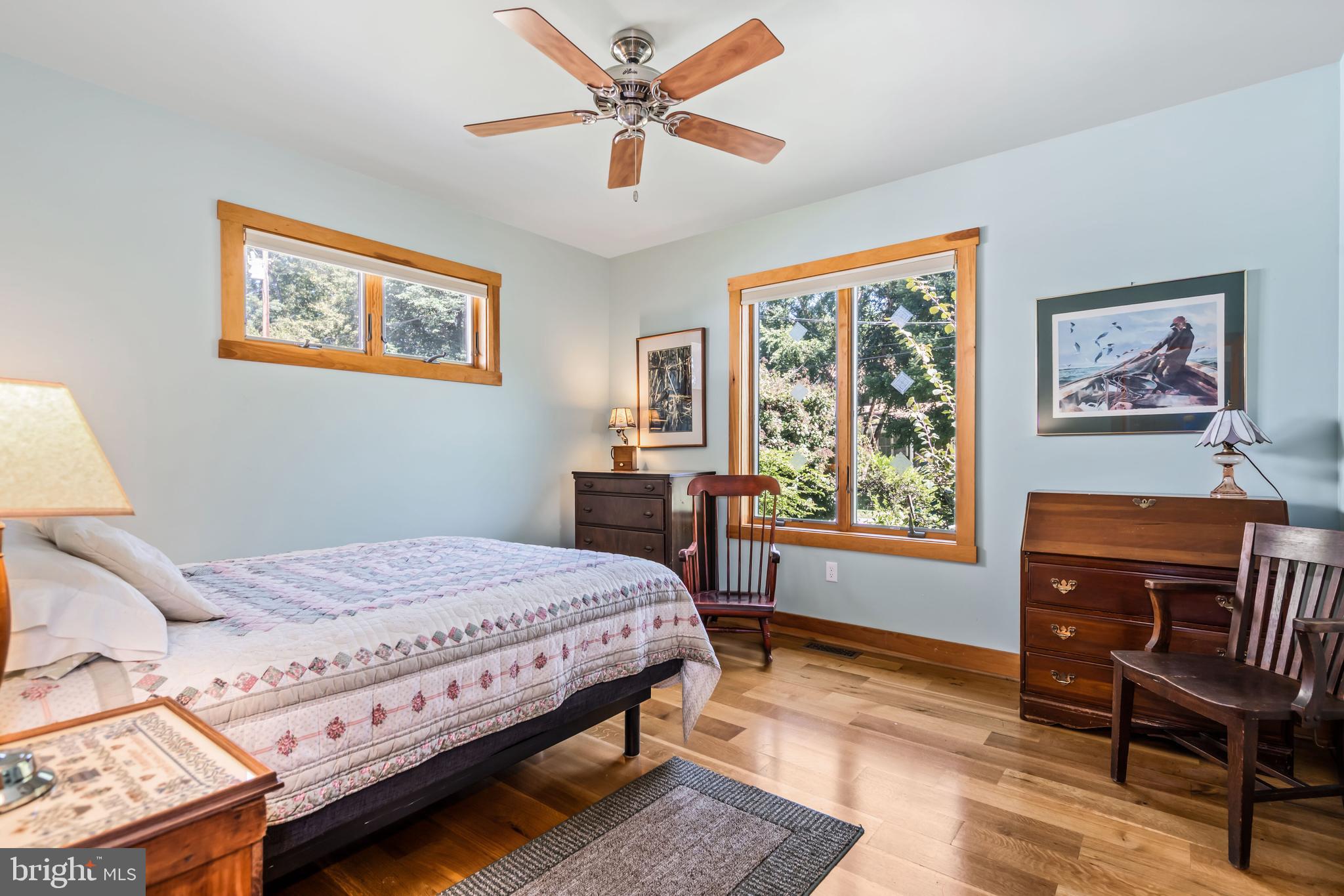 25209 Wymont Park Road Worton, MD 21678 - Photo 21 of 51 a bedroom with a bed a chair and a large window