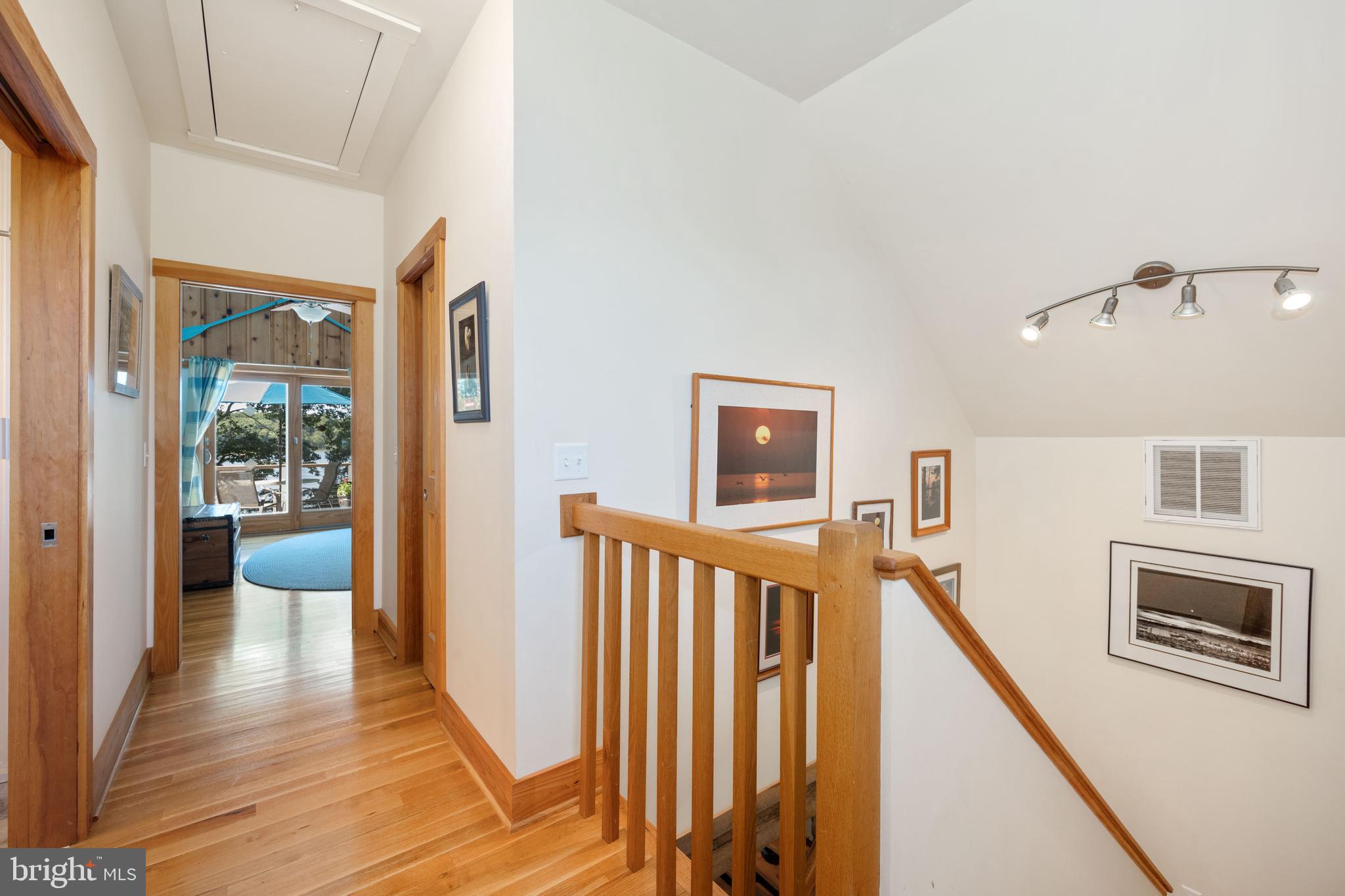 25209 Wymont Park Road Worton, MD 21678 - Photo 23 of 51 a view of a hallway with the wooden floor and staircase