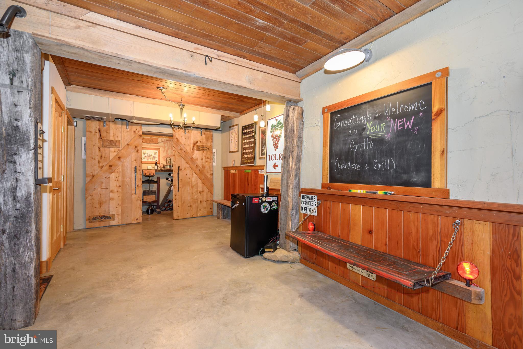 25209 Wymont Park Road Worton, MD 21678 - Photo 33 of 51 a view of a hallway with couch and wooden floor