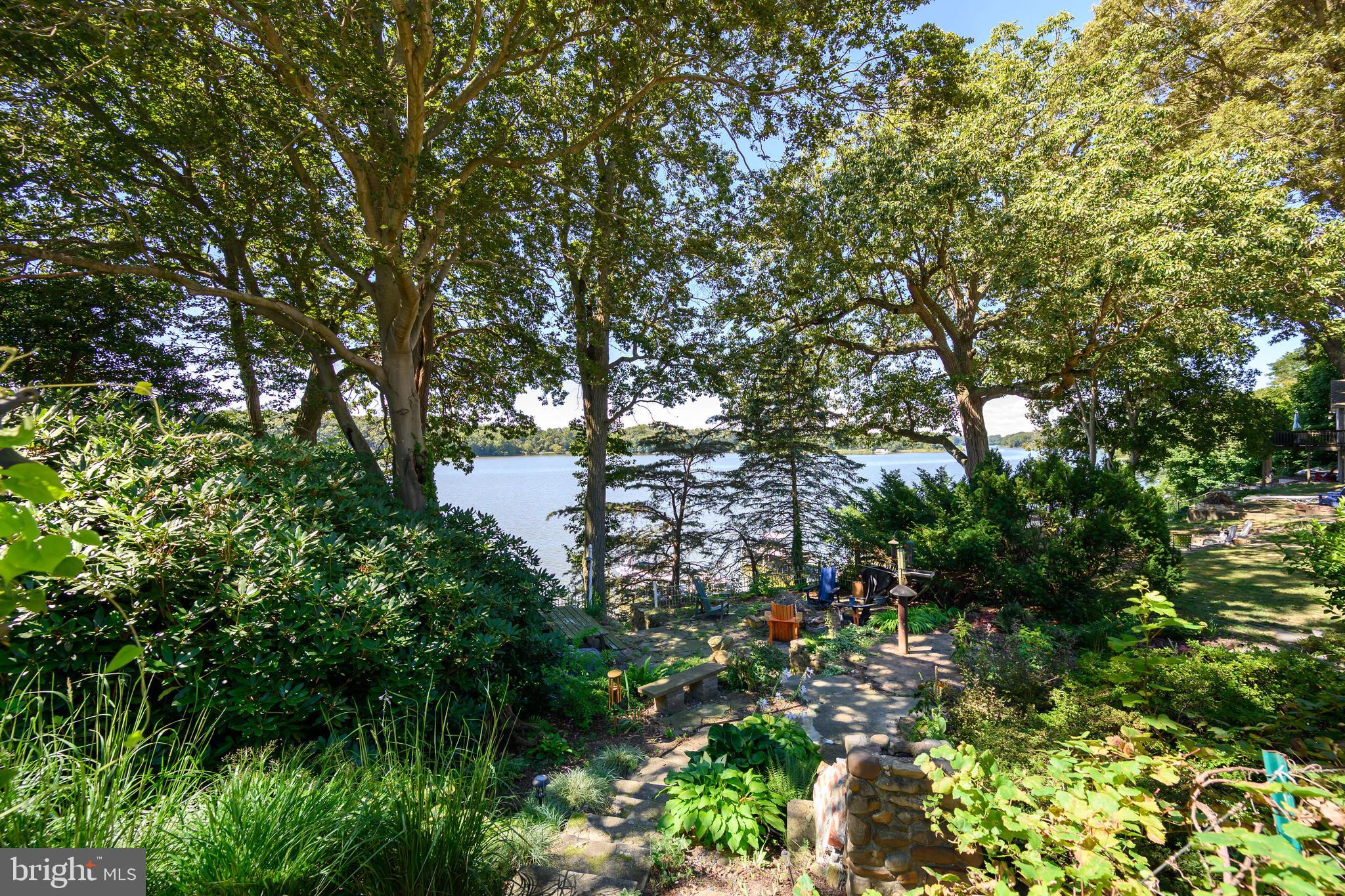 25209 Wymont Park Road Worton, MD 21678 - Photo 43 of 51 a backyard of a house with lots of green space and lake view