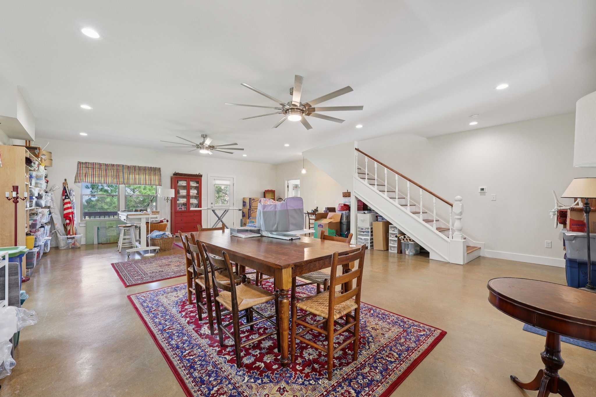 546 McAllister Road Bastrop, TX 78602 - Photo 37 of 40 Dining room featuring recessed lighting, a ceiling fan, and concrete floors