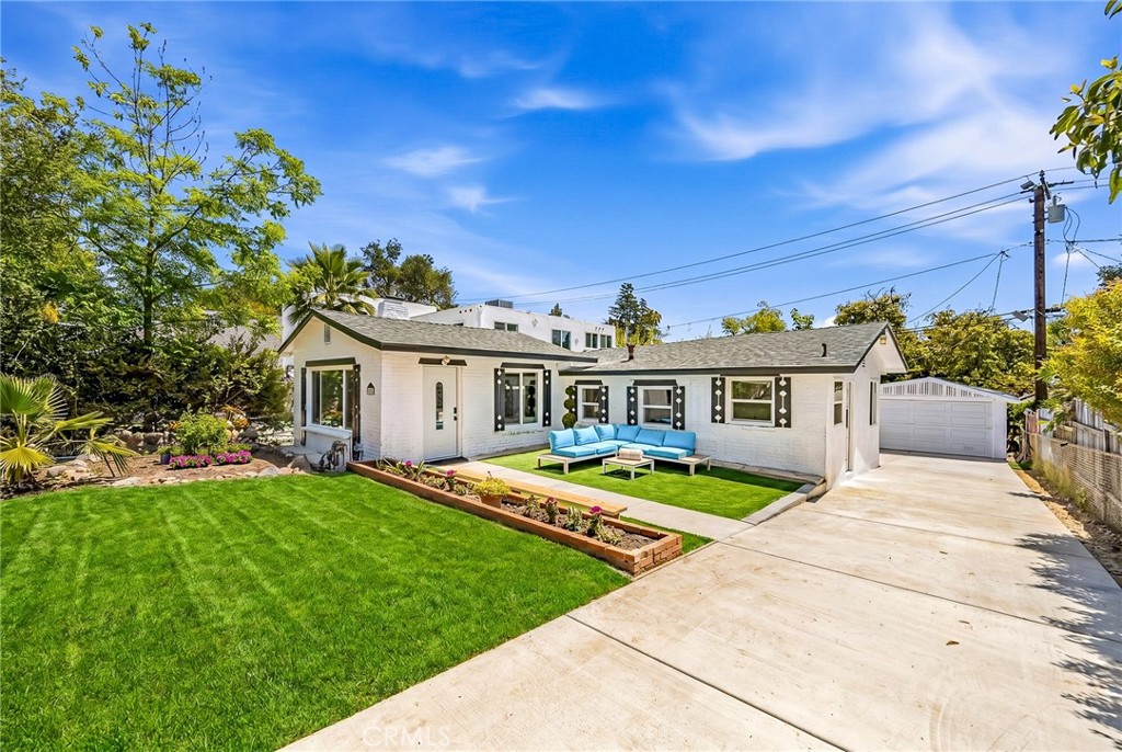 1280 East Woodbury Road Pasadena, CA 91104 - Photo 2 of 40 a view of house with outdoor space and swimming pool