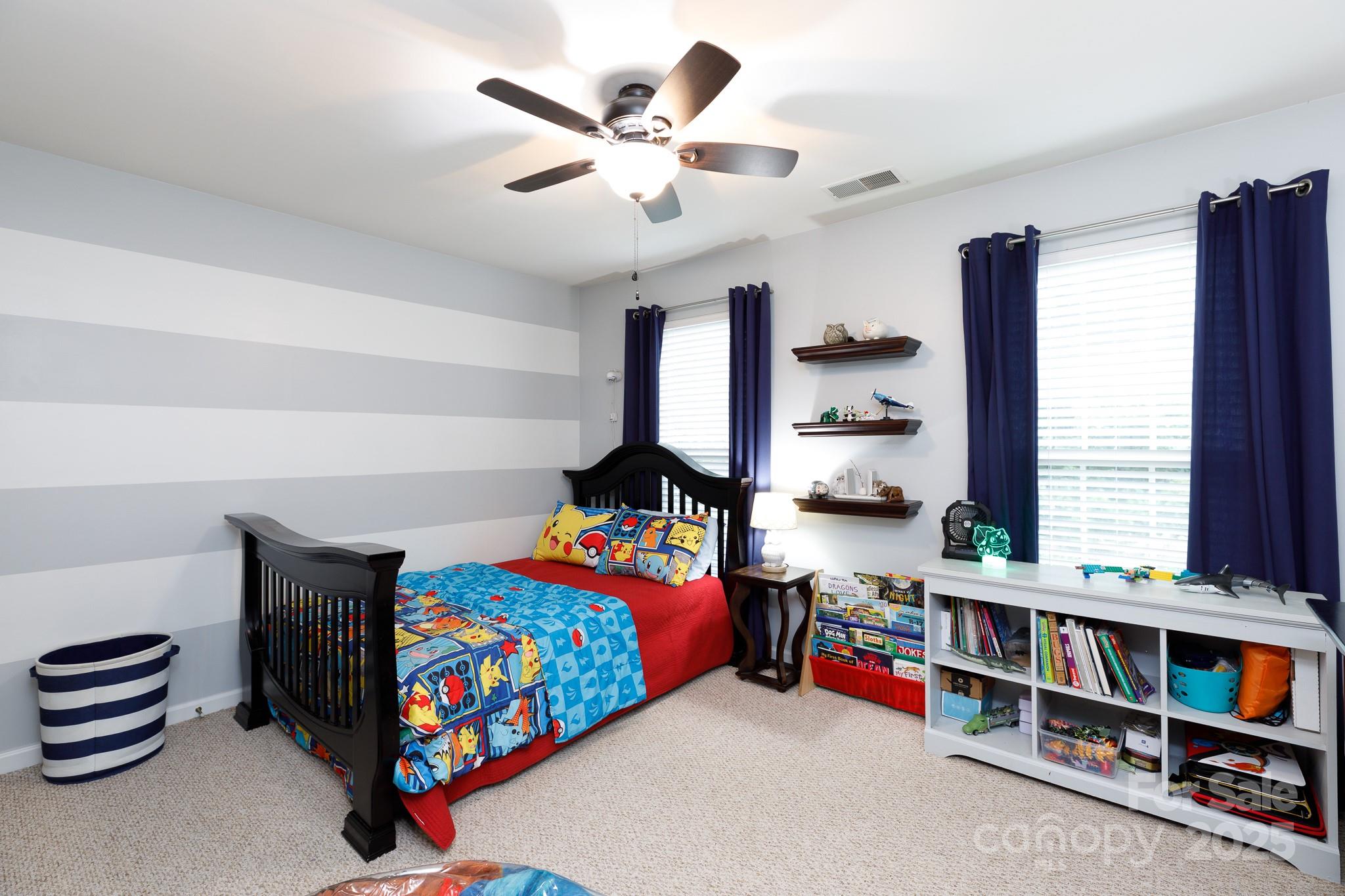 708 Drew Avenue Fort Mill, SC 29708 - Photo 19 of 30 a bedroom with furniture and a book shelf