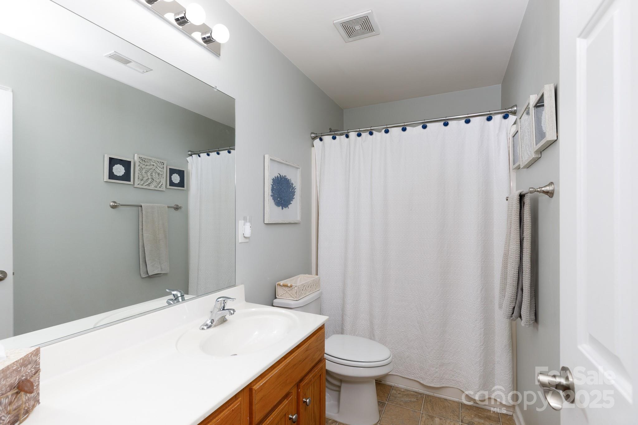 708 Drew Avenue Fort Mill, SC 29708 - Photo 21 of 30 a bathroom with a sink toilet and shower