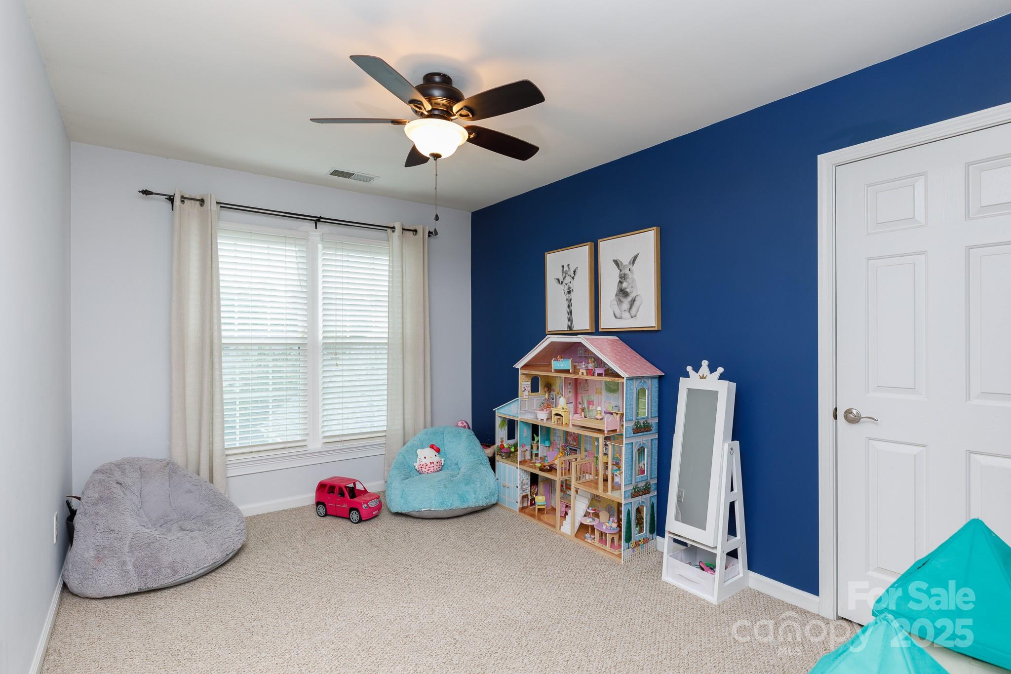 708 Drew Avenue Fort Mill, SC 29708 - Photo 28 of 30 a bedroom with furniture and a chandelier