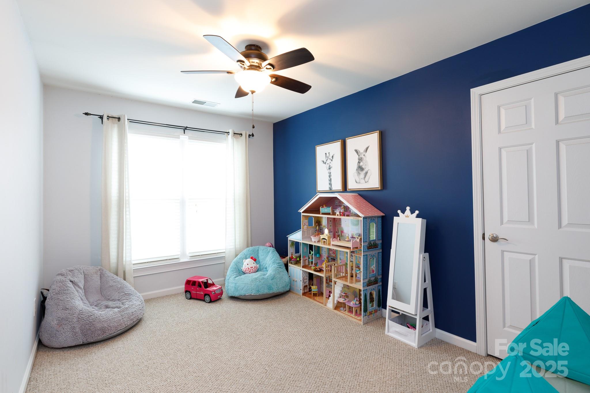 708 Drew Avenue Fort Mill, SC 29708 - Photo 30 of 30 a bedroom with furniture and a chandelier