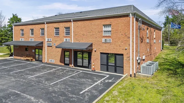 a front view of a house with yard