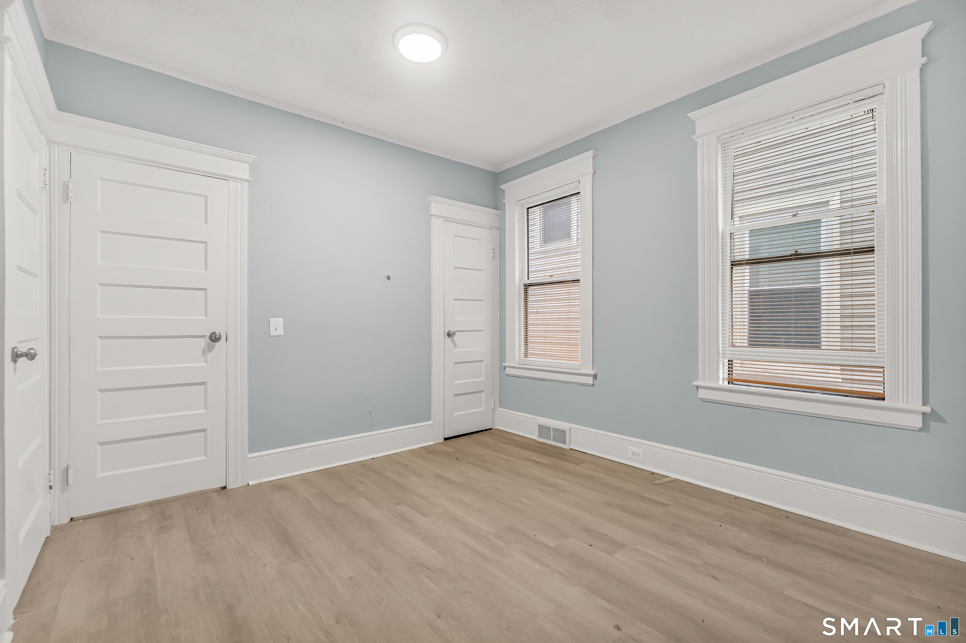 105 Carleton Avenue Bridgeport, CT 06604 - Photo 14 of 26 an empty room with windows