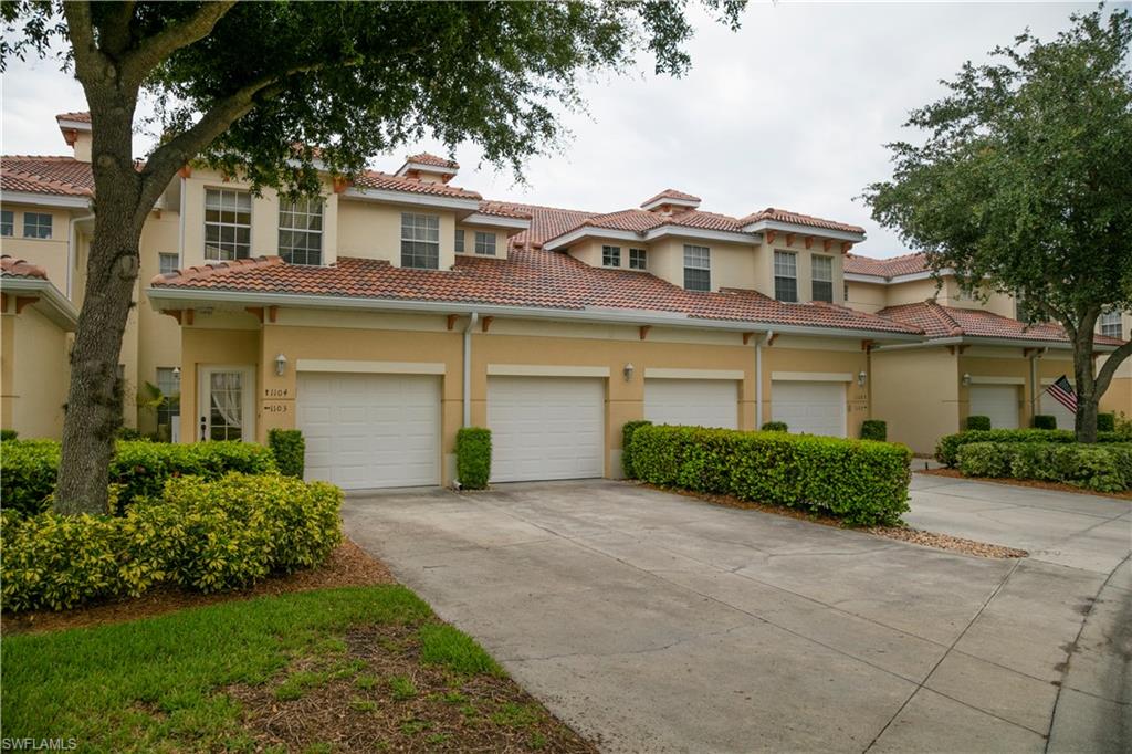 3048 Horizon Lane, Unit 1104 Naples, FL 34109 - Photo 9 of 16 front view of a house with a yard