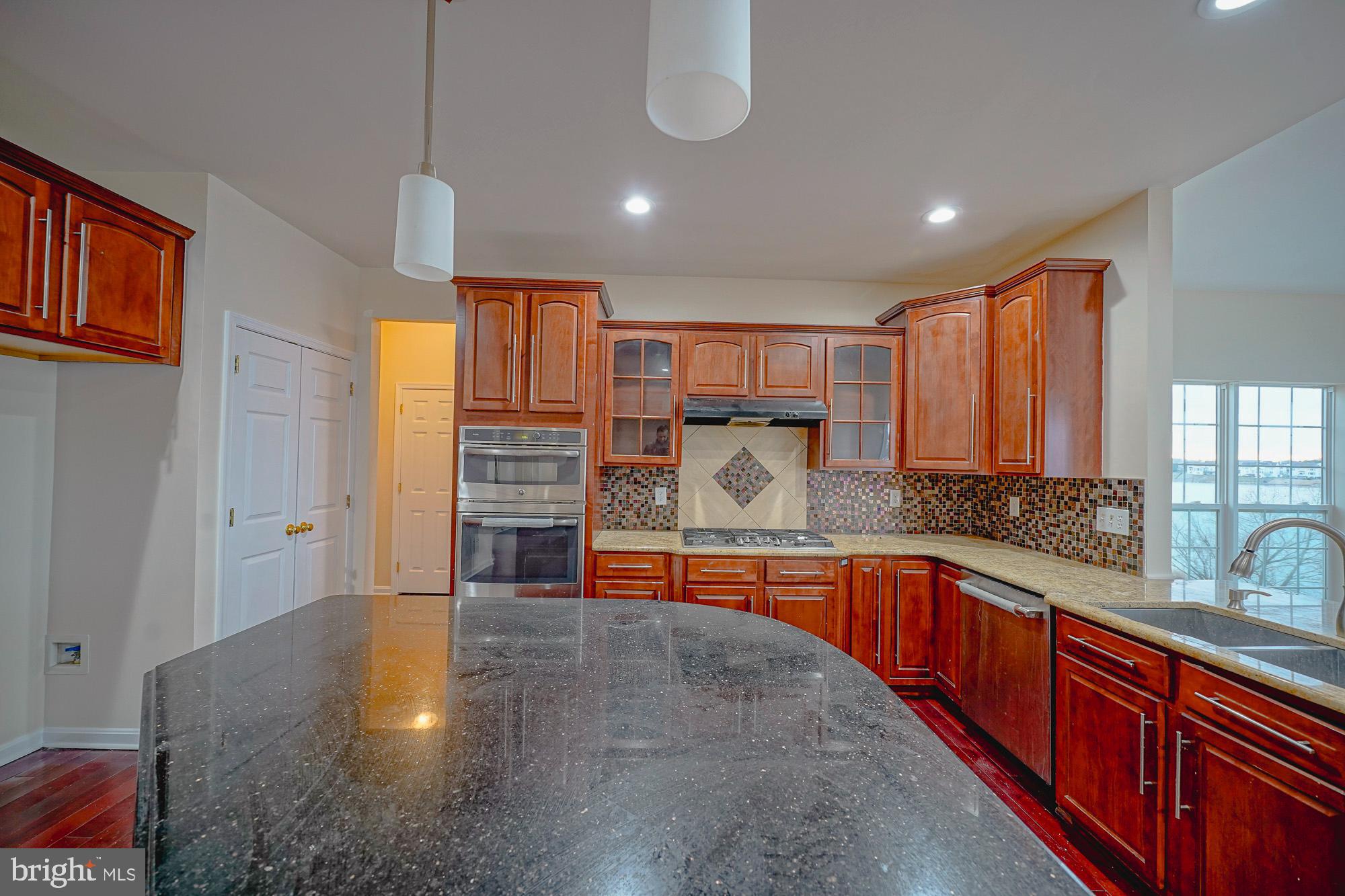 67 Mullen Drive Sicklerville, NJ 08081 - Photo 20 of 57 a view of a kitchen with a sink and a dishwasher