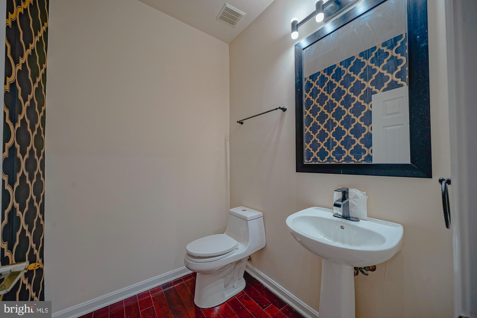 67 Mullen Drive Sicklerville, NJ 08081 - Photo 43 of 57 a bathroom with a toilet sink and mirror