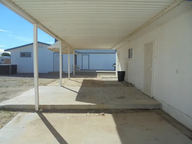 a view of a hall with wooden floor