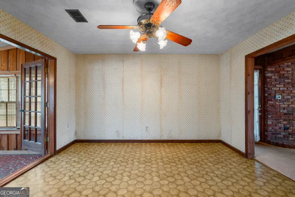 a view of a kitchen with a sink and a chandelier