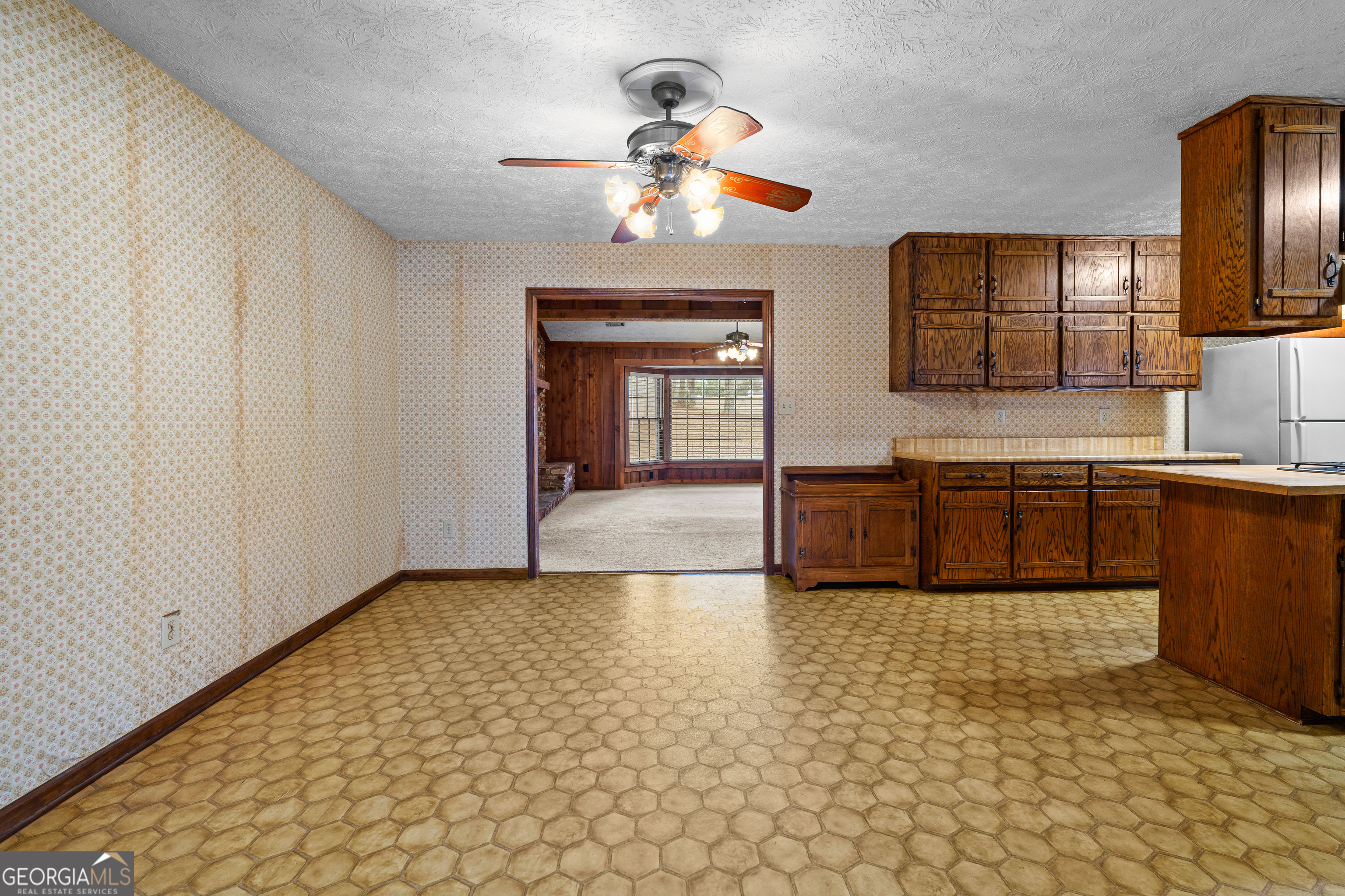 447 Adams Road Fayetteville, GA 30214 - Photo 16 of 52 a view of a kitchen with a sink and a chandelier