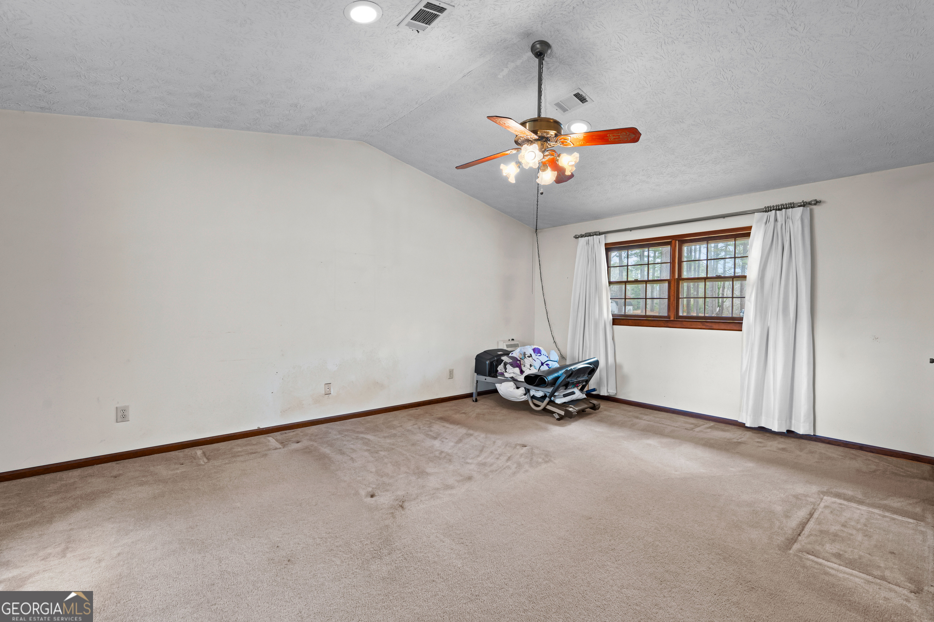 447 Adams Road Fayetteville, GA 30214 - Photo 30 of 52 a view of a room with a chandelier