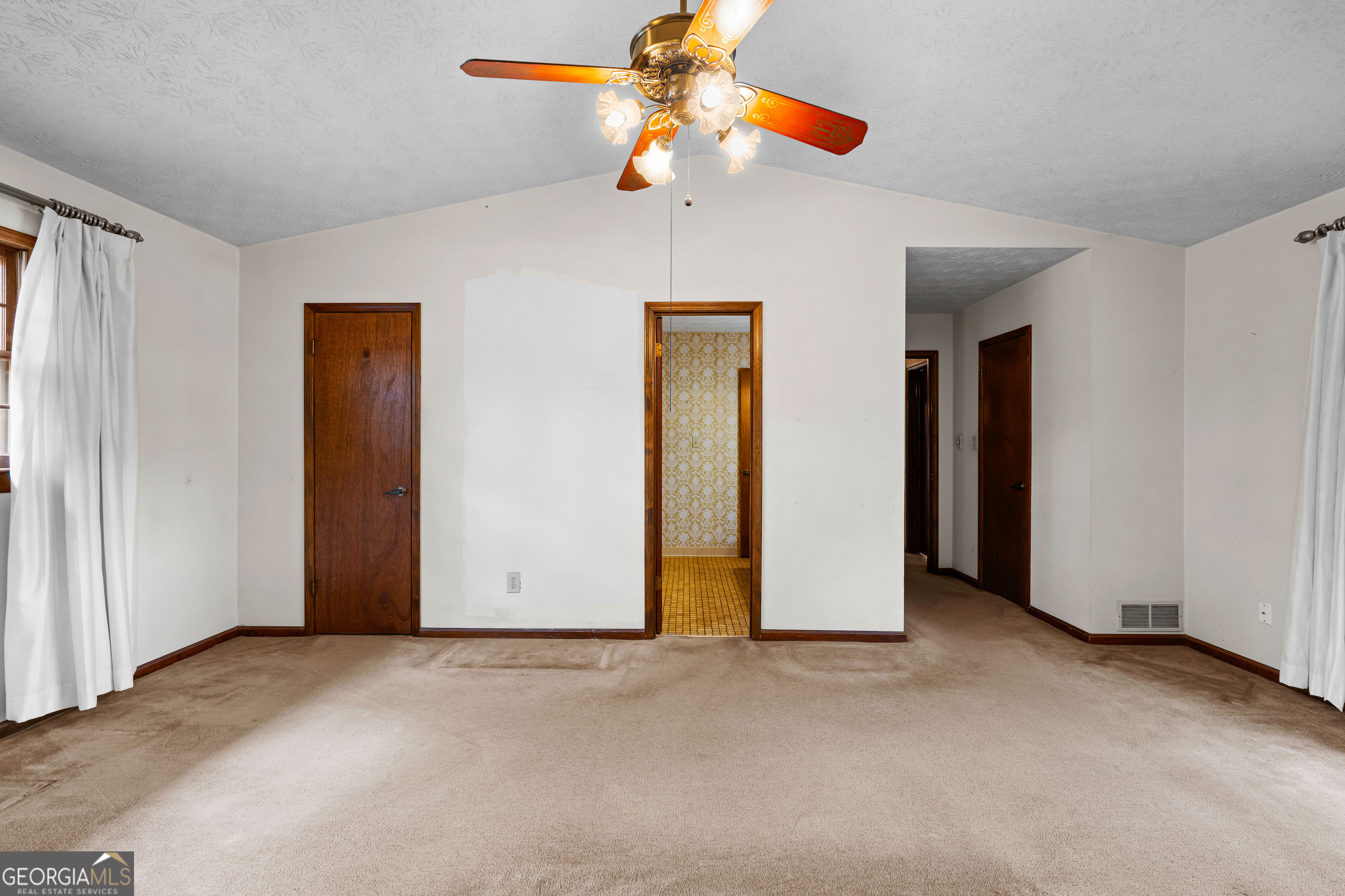 447 Adams Road Fayetteville, GA 30214 - Photo 32 of 52 a view of a room with a ceiling fan